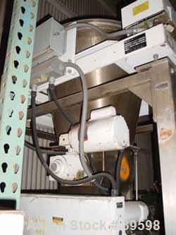 Used K-Tron Vertical Processor, Model 8561. Stainless steel construction, sanitary product contact parts, stainless steel agitator, 34" diameter stainless steel hopper, 6-1/4" side bottom stainless s...