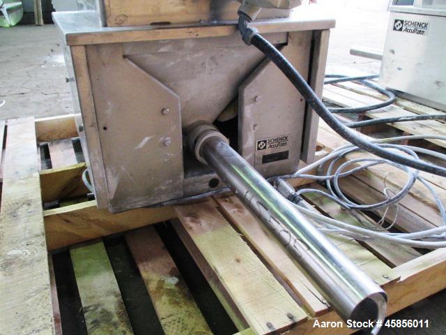 Used Schenk Accurate Volumetric Feeder, Type, MOD602M. Stainless steel screw and spout, 2.25" diameter x 21" long spout with screw, driven by approximately 0.25hp DC motor, stainless steel hopper ext...