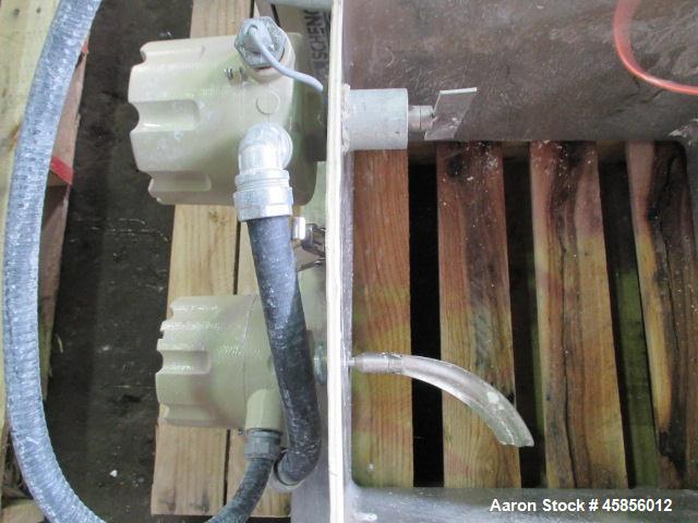 Used Schenk Accurate Volumetric Feeder, Type MOD602M. Stainless steel screw and spout, 2.25" diameter x 21" long spout with screw, driven by approximately 0.25hp DC motor, stainless steel hopper exte...