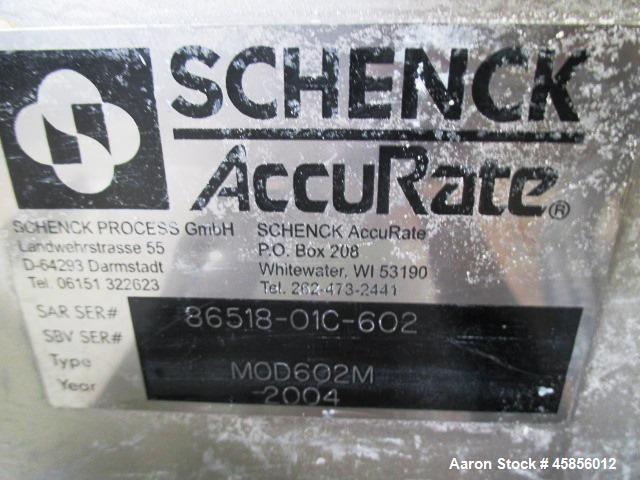 Used Schenk Accurate Volumetric Feeder, Type MOD602M. Stainless steel screw and spout, 2.25" diameter x 21" long spout with screw, driven by approximately 0.25hp DC motor, stainless steel hopper exte...