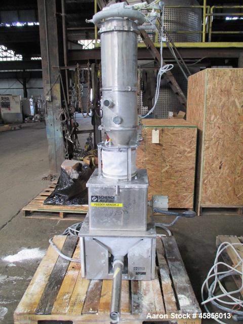 Used Schenk Accurate Volumetric Feeder, Type MOD602M. Stainless steel screw and spout, 2.25" diameter x 21" long spout with screw, driven by approximately 0.25 hp DC motor, stainless steel hopper ext...