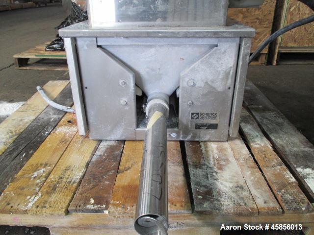 Used Schenk Accurate Volumetric Feeder, Type MOD602M. Stainless steel screw and spout, 2.25" diameter x 21" long spout with screw, driven by approximately 0.25 hp DC motor, stainless steel hopper ext...