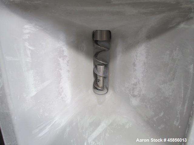 Used Schenk Accurate Volumetric Feeder, Type MOD602M. Stainless steel screw and spout, 2.25" diameter x 21" long spout with screw, driven by approximately 0.25 hp DC motor, stainless steel hopper ext...