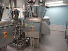 Used Schenk Process Systems Model Mechatron CF GRMD Metered Screw Feeder. Unit includes stainless steel hopper and controls.