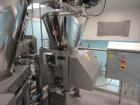 Used Schenk Process Systems Model Mechatron CF GRMD Metered Screw Feeder. Unit includes stainless steel hopper and controls.