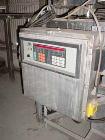 Used Acrison Wildflow Model 203 Feeder. Capacity approximately 2 lb batches. Stainless steel construction. Hard plastic conveyor, 36