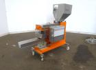 Used Engelhardt Continuous Dosing Weigher, Type KDE-GL 800E. Consists of top feed hopper, vibratory feeder with cover, weighing system, bottom discharge vibratory feeder. Has Engelhardt model DPC3000...