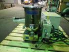 Used Ktron Gravimetric Feeder, Model F-1. Stainless steel construction, twin screw with agitated feed hopper, scale rated 24KG, 11KG net, 13KG tare, .132 HP motor, with controller, serial# 4501074067.