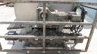 Used Volumetric Twin Screw Feeder.  Stainless steel twin screw feeder with agitator screw.  Screws driven by Eurodrive 3/4 hp each.  Hopper is 45