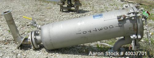 Used Filtration Systems Basket Strainer Filter, 316 stainless steel. Chamber approximately 8" diameter x 29" deep. Flat bolt down top cover, rated 150 at 450 deg.f.. 2" inlet/outlet. Removable basket...