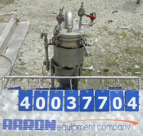Used Basket Strainer Filter, 316 Stainless Steel. Jacketed chamber approximately 8 1/2" diameter x 17 1/2" deep. Flat bolt down top cover. 2" inlet/outlet. Removable basket 7" diameter x 14" deep.