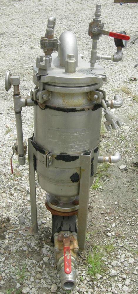Used Basket Strainer Filter, 316 Stainless Steel. Jacketed chamber approximately 8 1/2" diameter x 17 1/2" deep. Flat bolt down top cover. 2" inlet/outlet. Removable basket 7" diameter x 14" deep.