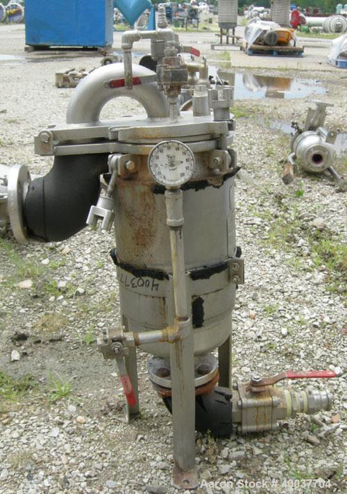 Used Basket Strainer Filter, 316 Stainless Steel. Jacketed chamber approximately 8 1/2" diameter x 17 1/2" deep. Flat bolt down top cover. 2" inlet/outlet. Removable basket 7" diameter x 14" deep.