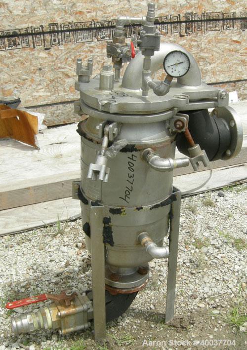 Used Basket Strainer Filter, 316 Stainless Steel. Jacketed chamber approximately 8 1/2" diameter x 17 1/2" deep. Flat bolt down top cover. 2" inlet/outlet. Removable basket 7" diameter x 14" deep.