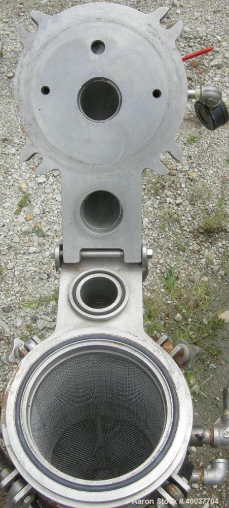 Used Basket Strainer Filter, 316 Stainless Steel. Jacketed chamber approximately 8 1/2" diameter x 17 1/2" deep. Flat bolt down top cover. 2" inlet/outlet. Removable basket 7" diameter x 14" deep.