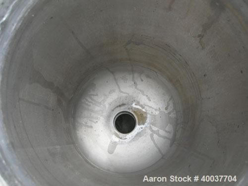 Used Basket Strainer Filter, 316 Stainless Steel. Jacketed chamber approximately 8 1/2" diameter x 17 1/2" deep. Flat bolt down top cover. 2" inlet/outlet. Removable basket 7" diameter x 14" deep.