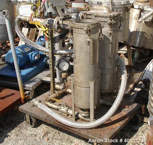 Used American Filter Dual Basket Filter, stainless steel construction, dual 7" diameter x 24" deep baskets, rated 150 PSI at 450 degrees F, on cart, Serial No. 386-9.