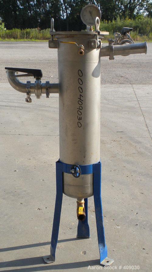 Used Basket Strainer Filter, 304 Stainless Steel. Chamber approximately 8 1/4" diameter x 33 1/2" deep. Flat bolt down top cover. 2" sanitary inlet/outlet. Removable basket 6 1/2" diameter x 27" deep...
