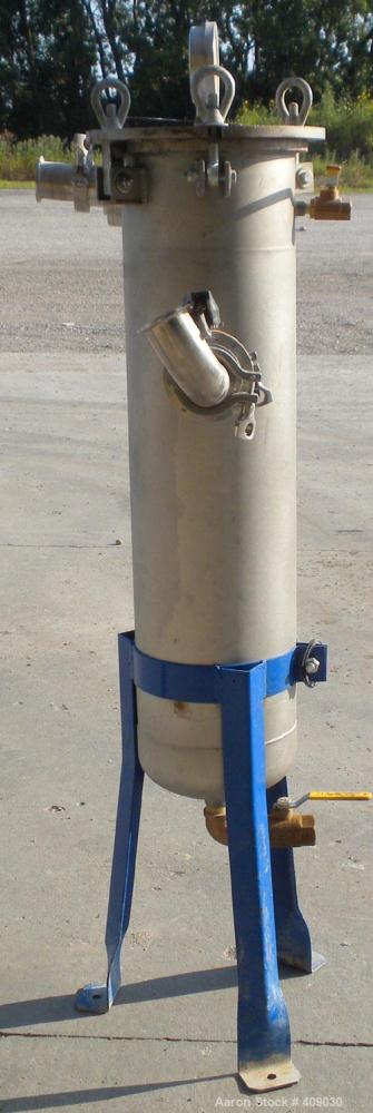 Used Basket Strainer Filter, 304 Stainless Steel. Chamber approximately 8 1/4" diameter x 33 1/2" deep. Flat bolt down top cover. 2" sanitary inlet/outlet. Removable basket 6 1/2" diameter x 27" deep...