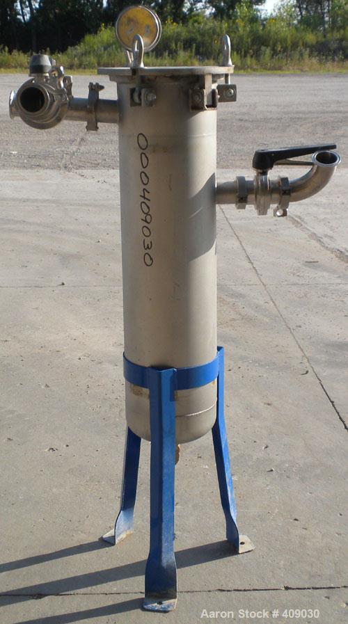 Used Basket Strainer Filter, 304 Stainless Steel. Chamber approximately 8 1/4" diameter x 33 1/2" deep. Flat bolt down top cover. 2" sanitary inlet/outlet. Removable basket 6 1/2" diameter x 27" deep...