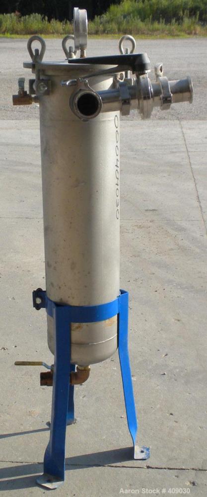 Used Basket Strainer Filter, 304 Stainless Steel. Chamber approximately 8 1/4" diameter x 33 1/2" deep. Flat bolt down top cover. 2" sanitary inlet/outlet. Removable basket 6 1/2" diameter x 27" deep...