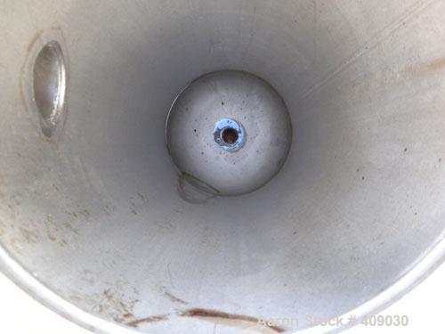 Used Basket Strainer Filter, 304 Stainless Steel. Chamber approximately 8 1/4" diameter x 33 1/2" deep. Flat bolt down top cover. 2" sanitary inlet/outlet. Removable basket 6 1/2" diameter x 27" deep...