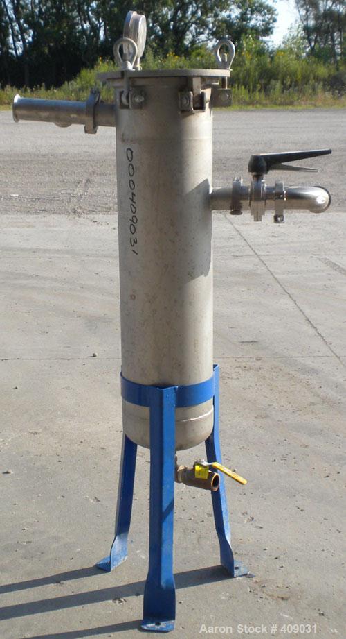 Used Basket Strainer Filter, 304 Stainless Steel. Chamber approximately 8 1/4" diameter x 33 1/2" deep. Flat bolt down top cover. 2" sanitary inlet/outlet. Removable basket 6 1/2" diameter x 27" deep...
