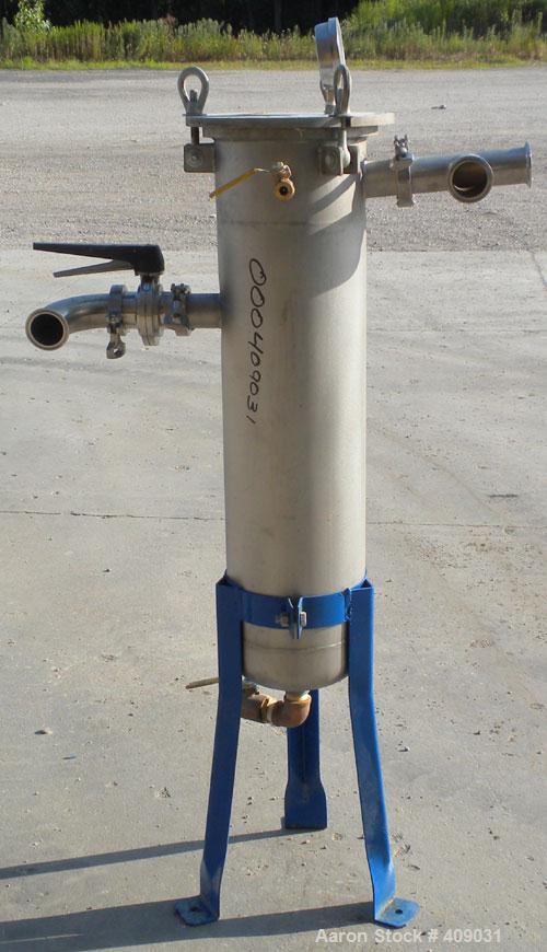 Used Basket Strainer Filter, 304 Stainless Steel. Chamber approximately 8 1/4" diameter x 33 1/2" deep. Flat bolt down top cover. 2" sanitary inlet/outlet. Removable basket 6 1/2" diameter x 27" deep...