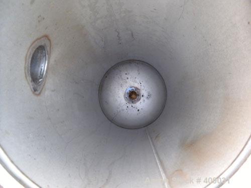 Used Basket Strainer Filter, 304 Stainless Steel. Chamber approximately 8 1/4" diameter x 33 1/2" deep. Flat bolt down top cover. 2" sanitary inlet/outlet. Removable basket 6 1/2" diameter x 27" deep...