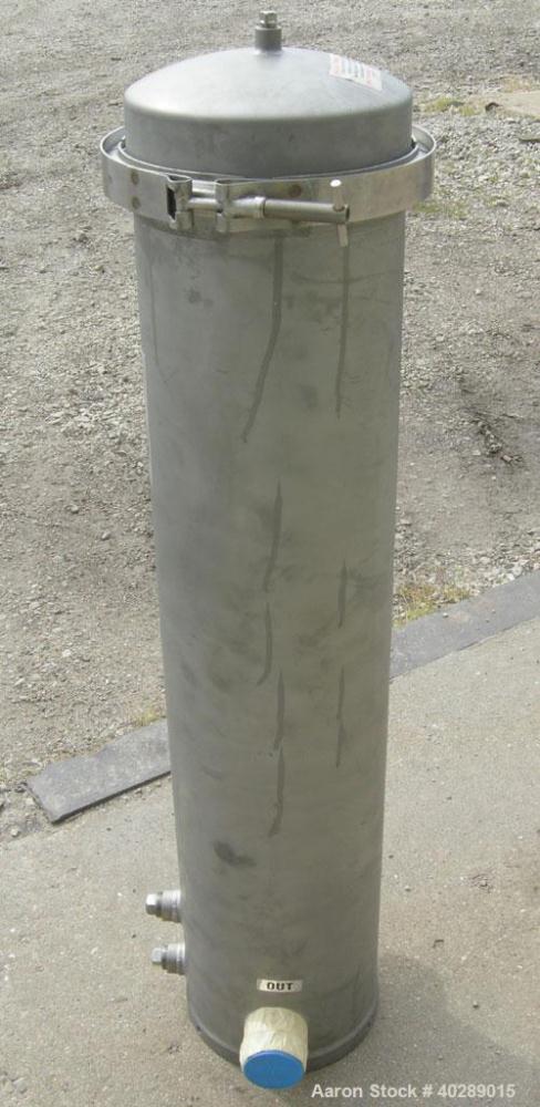 Unused-Cuno cartridge type filter, model 5DC3, 304 stainless steel. Approximate 1 square foot filter area. 8" diameter x 31" deep. Vertical housing rated 150 psi at 250 deg F. Clamp top cover, approx...