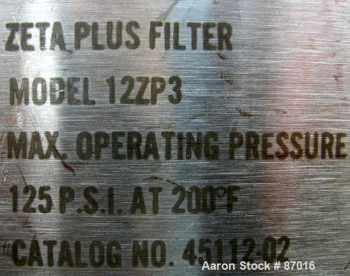 USED: AMF Cuno Zeta Plus cartridge filter, model 12ZP3, 316 stainless steel. 12" diameter x 36" long. Dish top, flat bolt-on bottom. Internal rated 125 psi at 200 deg F. 2" inlet/outlet. Mounted on a...