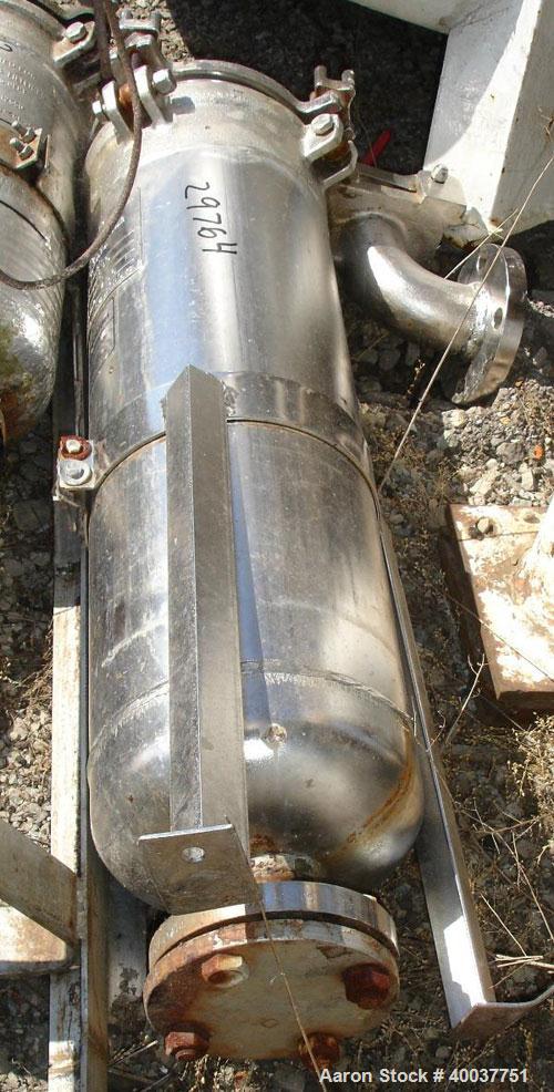 Used American Basket Filter, Stainless Steel. 7" Diameter x 24" deep baskets, rated 150 psi at 150 degrees F, serial #7980.