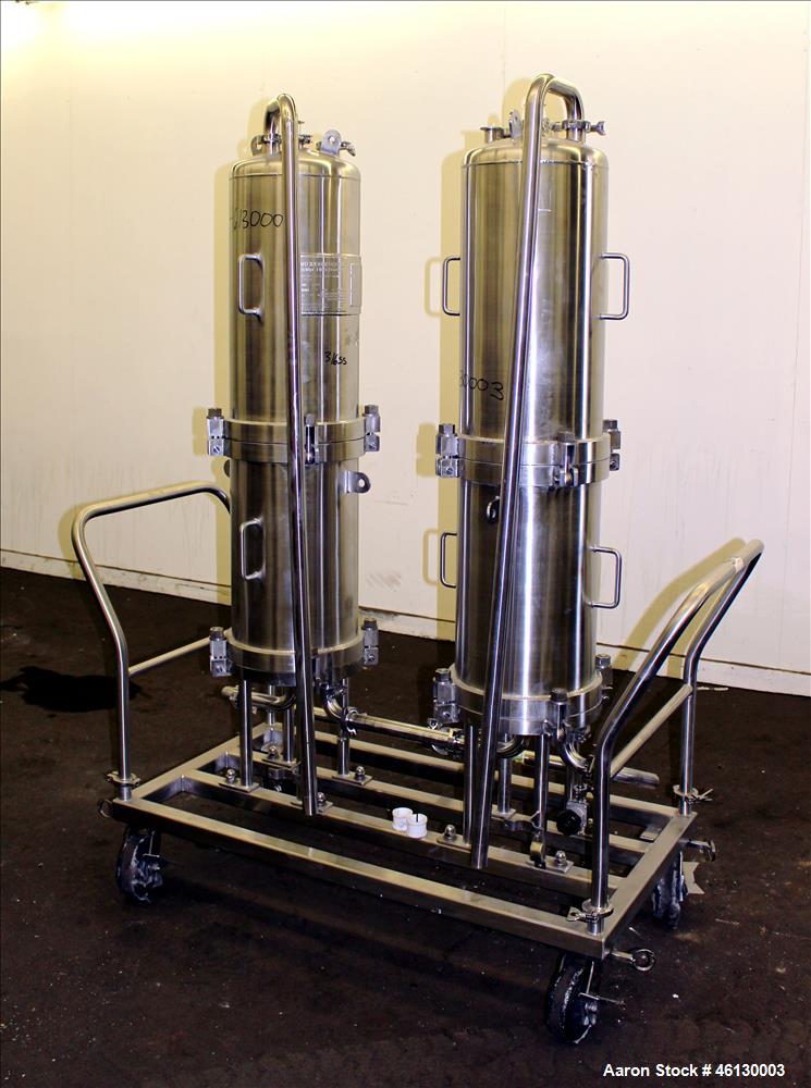 Used Cuno Dual Filter Skid, Model 12ZPB4, 316L Stainless Steel. (2) Cartridge filter housings, no filters, approximately 12-1/2" diameter x 47" straight side. Internal rated 75 psi/full vacuum at -20...