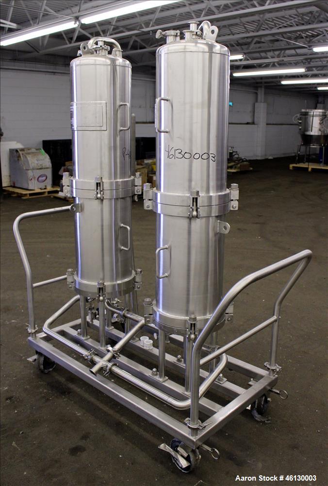 Used Cuno Dual Filter Skid, Model 12ZPB4, 316L Stainless Steel. (2) Cartridge filter housings, no filters, approximately 12-1/2" diameter x 47" straight side. Internal rated 75 psi/full vacuum at -20...