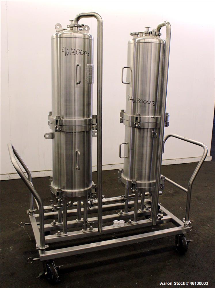 Used Cuno Dual Filter Skid, Model 12ZPB4, 316L Stainless Steel. (2) Cartridge filter housings, no filters, approximately 12-1/2" diameter x 47" straight side. Internal rated 75 psi/full vacuum at -20...