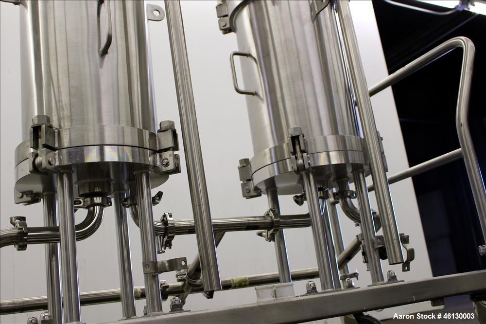 Used Cuno Dual Filter Skid, Model 12ZPB4, 316L Stainless Steel. (2) Cartridge filter housings, no filters, approximately 12-1/2" diameter x 47" straight side. Internal rated 75 psi/full vacuum at -20...