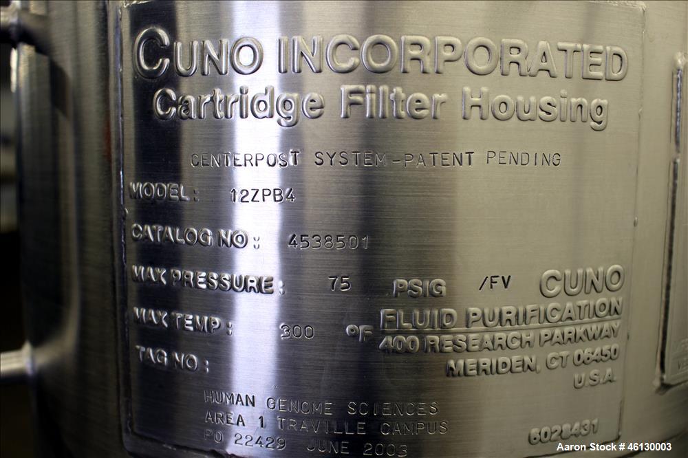 Used Cuno Dual Filter Skid, Model 12ZPB4, 316L Stainless Steel. (2) Cartridge filter housings, no filters, approximately 12-1/2" diameter x 47" straight side. Internal rated 75 psi/full vacuum at -20...
