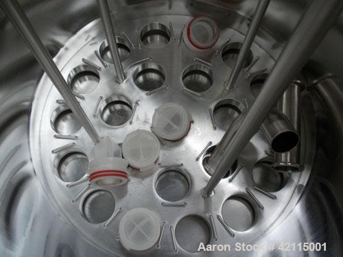 Used Cuno Cartridge Filter, Model 21ZWB4, 316L stainless steel, vertical. Approximately 280 square feet filter area. 17-3/4" diameter x 47-3/4" deep. Provision for 21 cartridges. Internal rated 75/-1...
