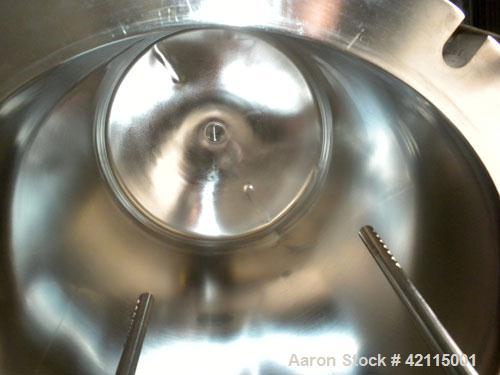 Used Cuno Cartridge Filter, Model 21ZWB4, 316L stainless steel, vertical. Approximately 280 square feet filter area. 17-3/4" diameter x 47-3/4" deep. Provision for 21 cartridges. Internal rated 75/-1...