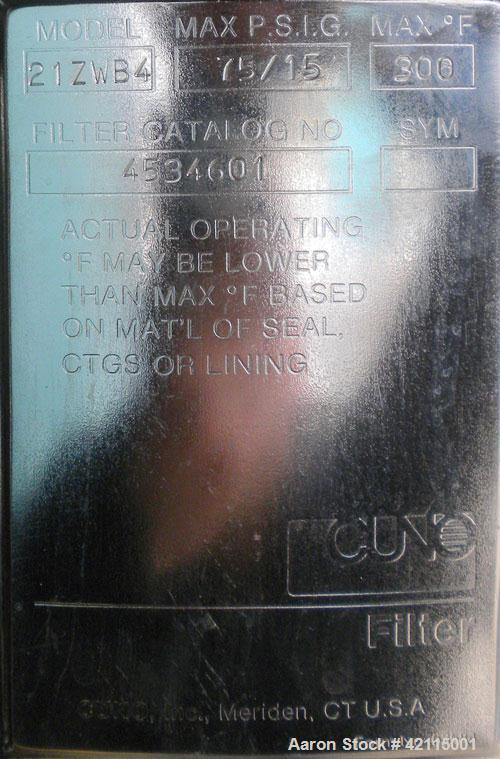 Used Cuno Cartridge Filter, Model 21ZWB4, 316L stainless steel, vertical. Approximately 280 square feet filter area. 17-3/4" diameter x 47-3/4" deep. Provision for 21 cartridges. Internal rated 75/-1...