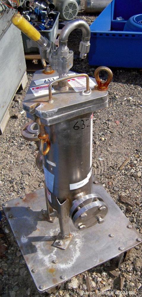 Used Filter Specialists Cartridge Filter, Model FSCN-311, Hastelloy C. 6 1/2" diameter x 16" deep vessel rated 150 psi at 250 deg F. Bolt-on top cover, 1 1/2" inlet/outlet. Mounted on a base with cas...