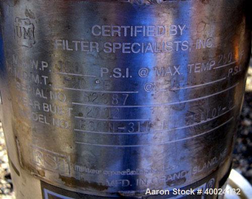 Used Filter Specialists Cartridge Filter, Model FSCN-311, Hastelloy C. 6 1/2" diameter x 16" deep vessel rated 150 psi at 250 deg F. Bolt-on top cover, 1 1/2" inlet/outlet. Mounted on a base with cas...