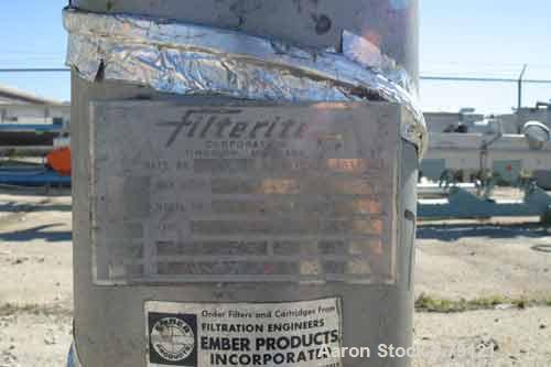 USED: Filterite cartridge filter, model 18FM03A-2, 304 stainless steel. 8-1/4" diameter x 37" straight side, 5 cartridge filters. Liquid flow rate up to 90 gallons per minute. 2" NPT inlet/outlet. Ra...