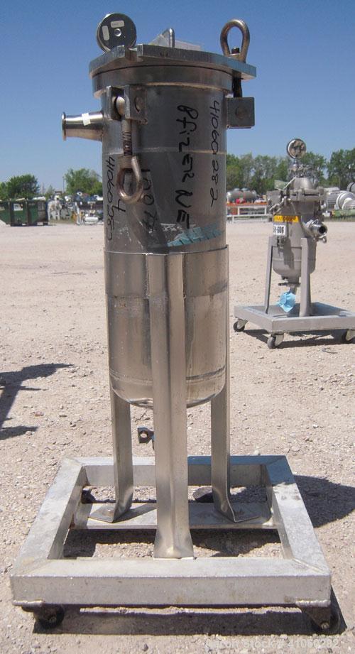 Used Mesh Basket Filter, 304 Stainless Steel. Approximate 8 1/2" diameter x 24" deep vessel. 6 1/2" diameter x 12" deep basket. Bolt-on top cover, 1 1/2" tri-clamp inlet/outlet. Mounted on 3 stainles...