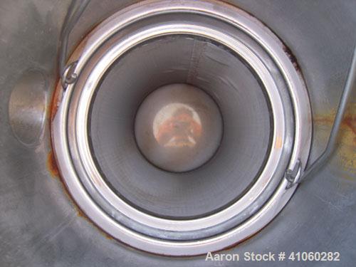 Used Mesh Basket Filter, 304 Stainless Steel. Approximate 8 1/2" diameter x 24" deep vessel. 6 1/2" diameter x 12" deep basket. Bolt-on top cover, 1 1/2" tri-clamp inlet/outlet. Mounted on 3 stainles...