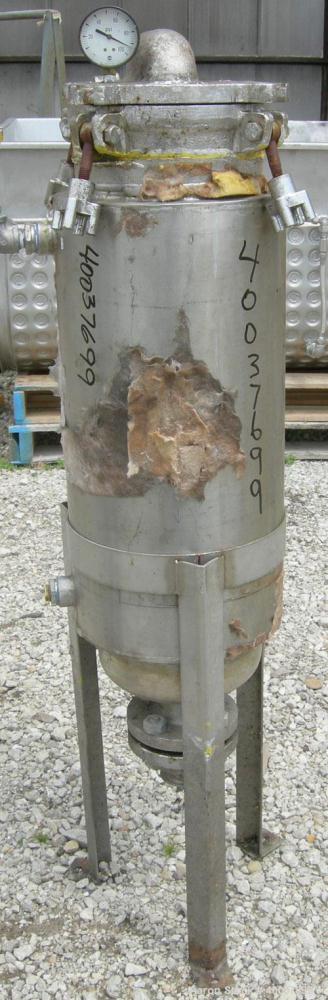 Used Basket Strainer Filter, 316 stainless steel. Jacketed chamber approximately 8" diameter x 29" deep. Flat bolt down top cover. 2" inlet/outlet. Removable basket 7" diameter x 28 1/2" deep.