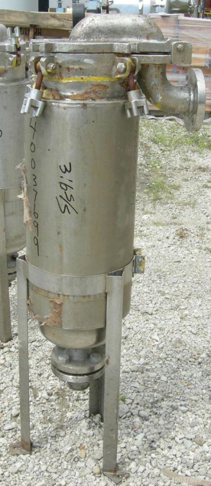 Used Basket Strainer Filter, 316 stainless steel. Jacketed chamber approximately 8" diameter x 29" deep. Flat bolt down top cover. 2" inlet/outlet. Removable basket 7" diameter x 28 1/2" deep.
