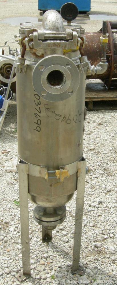 Used Basket Strainer Filter, 316 stainless steel. Jacketed chamber approximately 8" diameter x 29" deep. Flat bolt down top cover. 2" inlet/outlet. Removable basket 7" diameter x 28 1/2" deep.