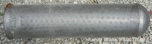 Used Basket Strainer Filter, 316 stainless steel. Jacketed chamber approximately 8" diameter x 29" deep. Flat bolt down top cover. 2" inlet/outlet. Removable basket 7" diameter x 28 1/2" deep.
