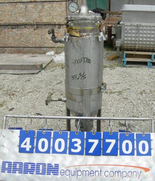 Used Basket Strainer Filter, 316 stainless steel. Jacketed chamber approximately 8" diameter x 29" deep. Flat bolt down top cover. 2" inlet/outlet. Removable basket 7" diameter x 28 1/2" deep.